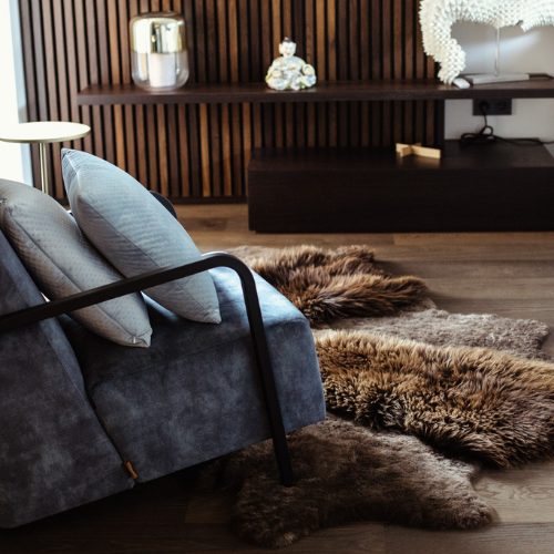 https://spotted.world/wp-content/uploads/2023/08/Elegance-Redefined-Handmade-European-Sheepskin-Patchwork-Rug-A-Luxurious-Masterpiece-from-Belgium_Brown_Natural.png